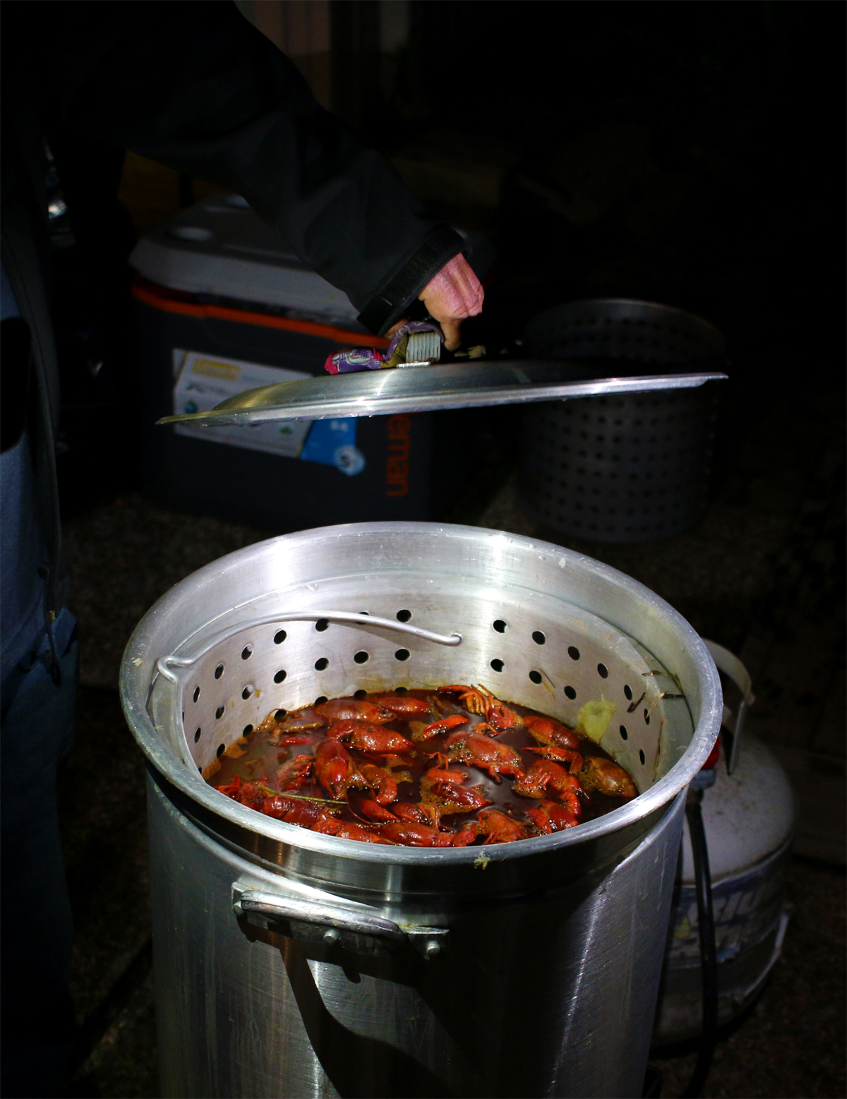 A photo of a pot of boiling crawfish