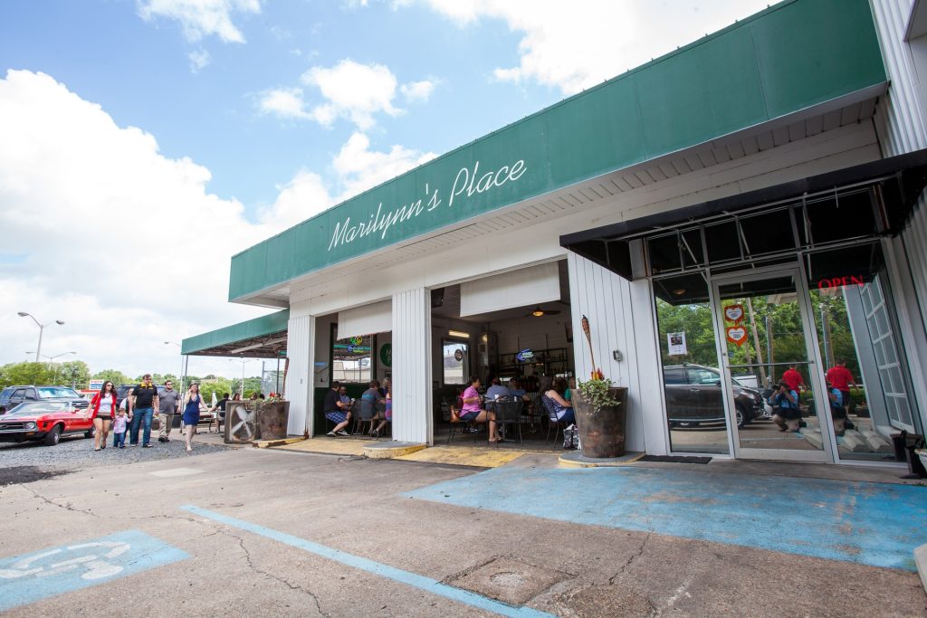 A photograph shows a restaurant that appears to be located in a rehabilitated garage